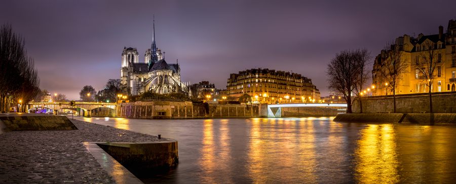 Notre-Dame de Paris at night above the Seine