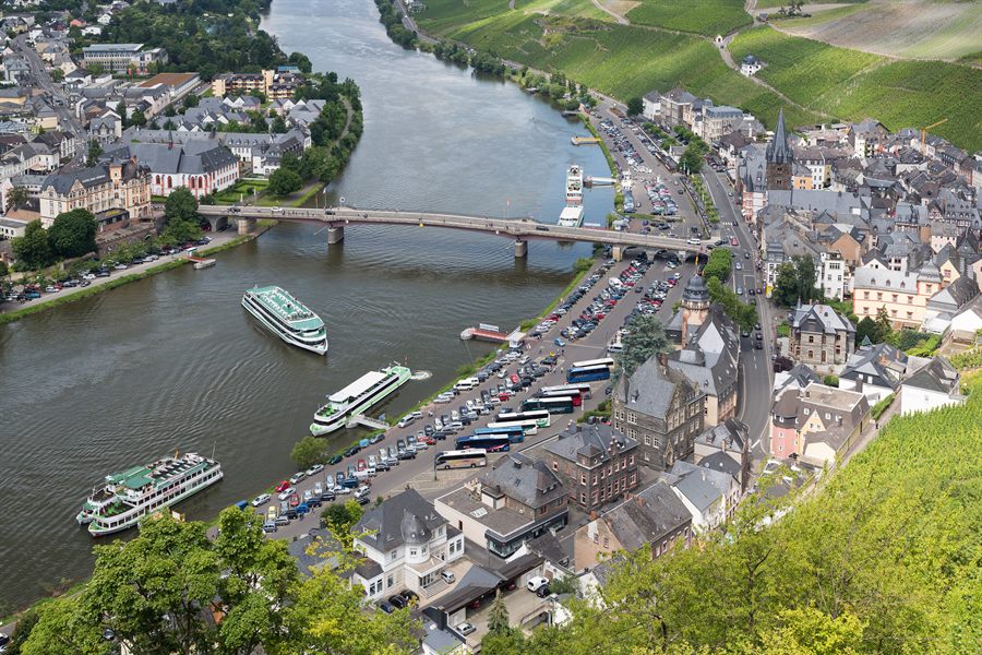 River cruise ships moored beside the old town of Bernkastel